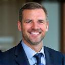 Portrait of Michael B., a confident and experienced consultant in a professional, yet relaxed, setting.